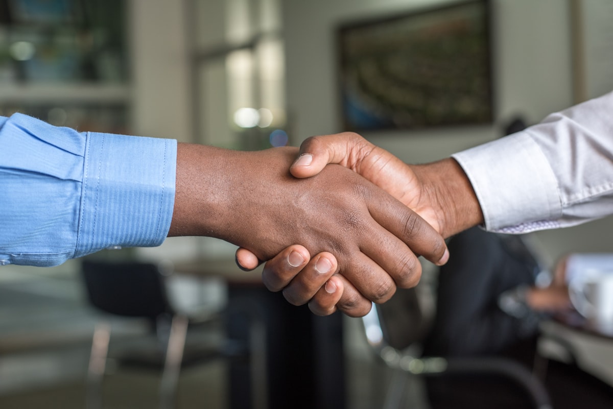 Two business partners shaking hands